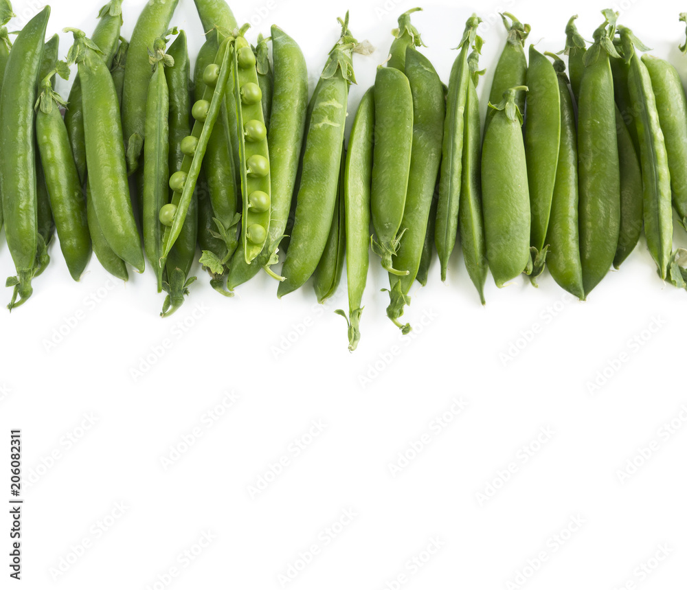 Green peas on a white background. Vegetables with copy space for text. Fresh green peas on a white background. Top view. Green peas on a white background. Vegetables with copy space for text. Fresh green peas on a white background. Top view.