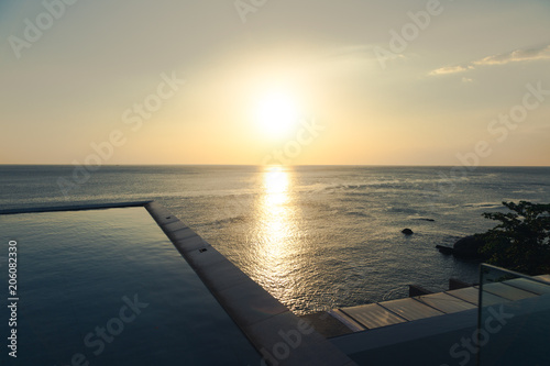 Yellow sunset over seaside  look out from hotel view