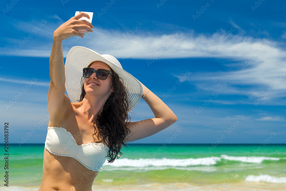 Beautiful Woman at the beach in Thailand taking a selfie Beautiful Woman at the beach in Thailand taking a selfie