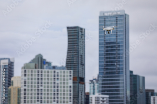 Image of a drone with a skyscraper in the background