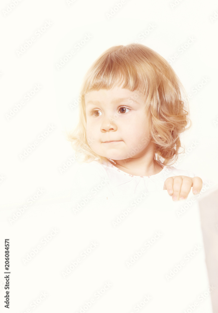 Portrait of a cute little girl in a white dress on white background Portrait of a cute little girl in a white dress on white background