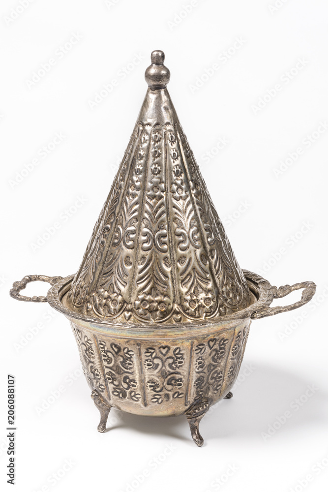 Obraz premium Elegant metal Tajine pot used in Couscous based recipes in Northern Africa