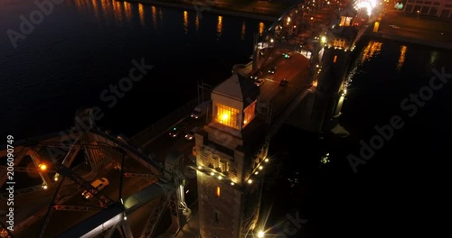 Aerial beautiful sunset view of the bridge with towers at night with the illuminated light, Saint Petersburg, Russia