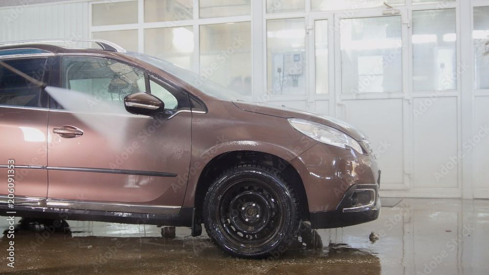 Fototapeta Washed car in car wash side view