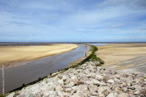 Coastal defence and entrance, with beacons, to harbour in Rhyl, Denbighshire, Wales, UK photo