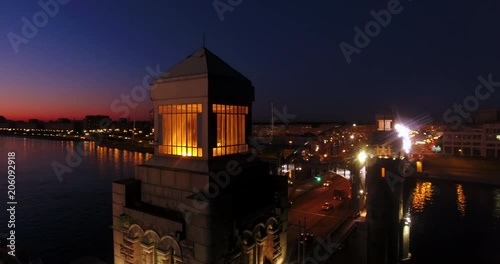 Aerial beautiful sunset view of the bridge with towers at night with the illuminated light, Saint Petersburg, Russia