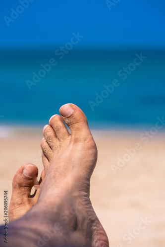 Bare Foot On Sea Beach © Aris Suwanmalee