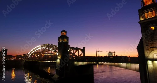 Aerial beautiful sunset view of the bridge with towers at night with the illuminated light, Saint Petersburg, Russia
