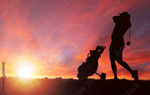 Golfer Silhouette During Sunset With Copy Space