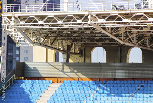The structure of the stadium, empty rows of blue seats photo