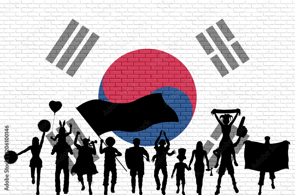 Obraz premium Korean supporter silhouette in front of brick wall with South Korea flag