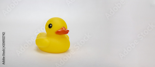 A yellow rubber duck on an isolated white background with room for text and other objects! 