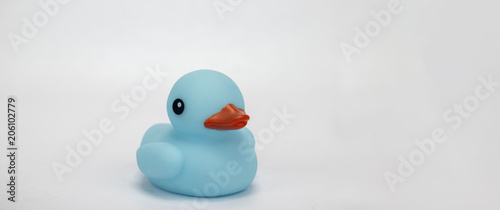 A blue rubber duck on an isolated white background 