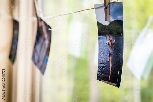 Photos hanging in a window