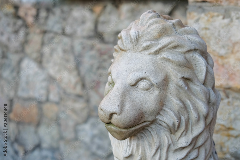 Stone head lion statue