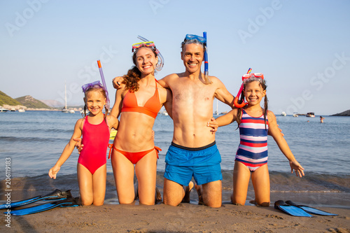 family on the beach photo