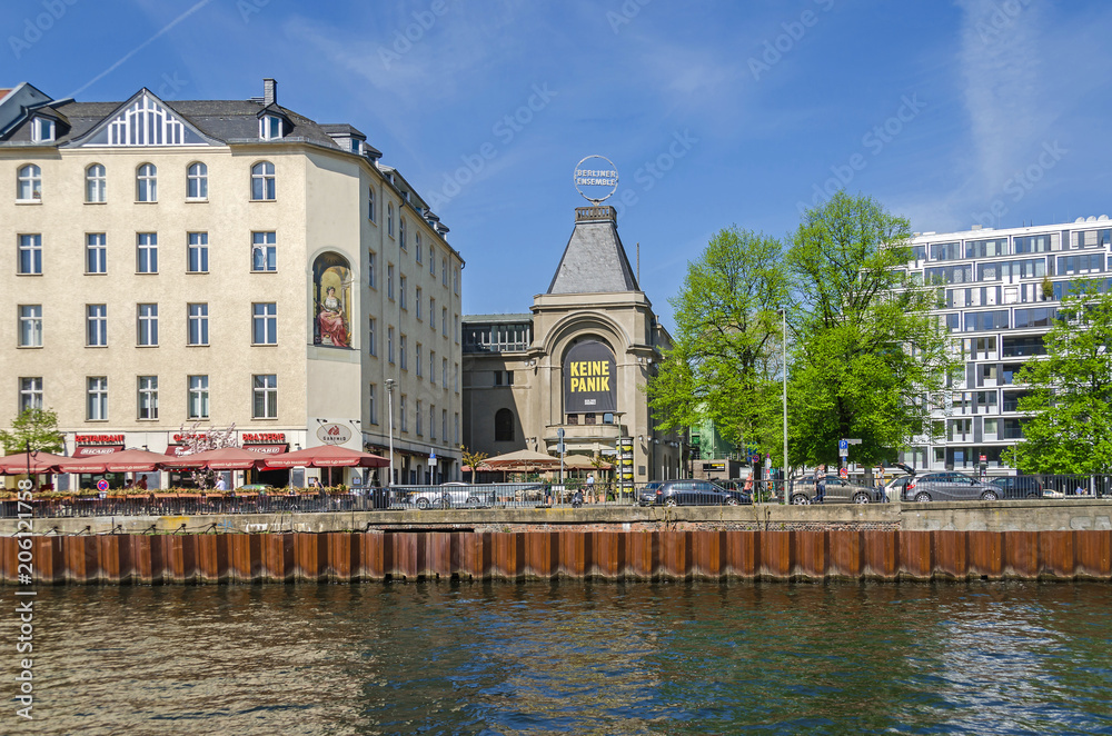 Fototapeta premium The Berliner Ensemble and the well known location Ganymed Brasserie on a bank of the river Spree Schiffbauerdamm