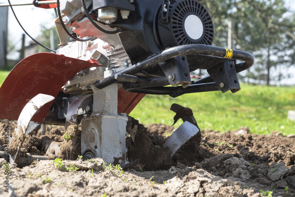 Agricultural machinery. Cultivator for loosening soil in the garden.. Agricultural machinery. Cultivator for loosening soil in the garden..