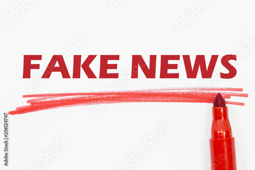 FAKE NEWS word written with red marker