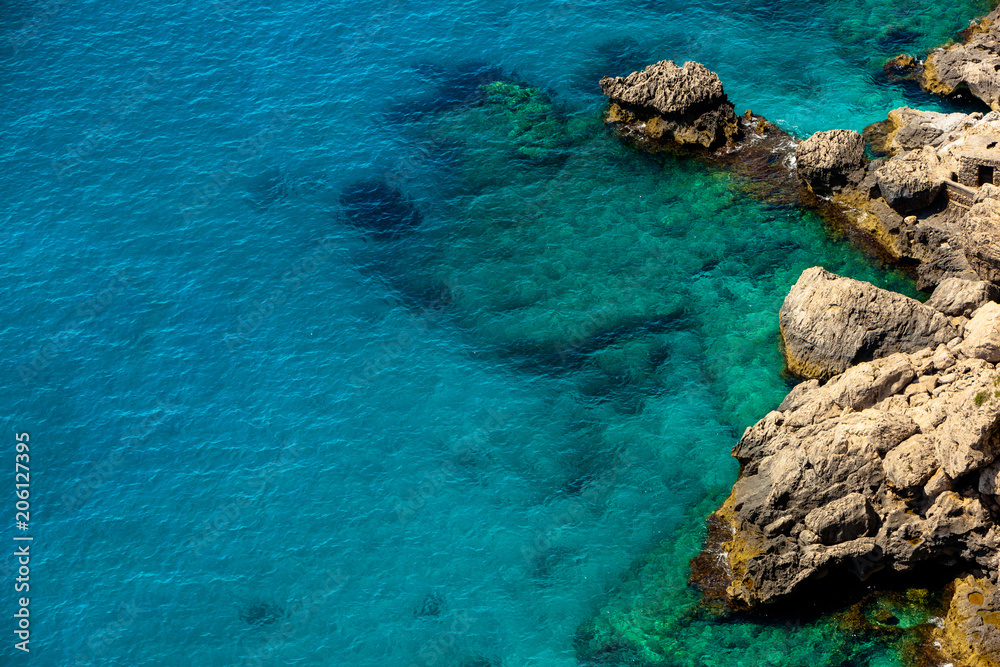 Crystal clear Water at the rocky Coast of Capri Island, Italy Crystal clear Water at the rocky Coast of Capri Island, Italy