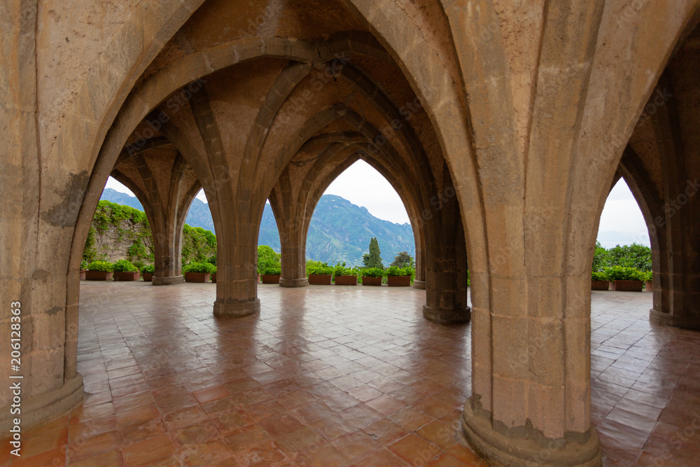 Ravello, Italy - April 28 2018:  Arches of the Villa Cimbrone with a View to the beautiful Mountains around