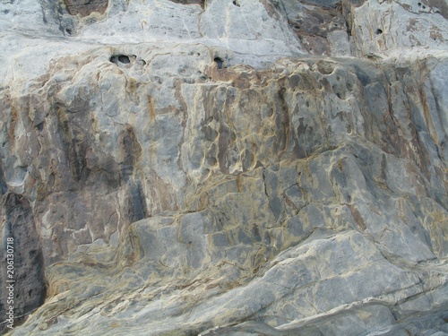 textured rock surface of cliff face