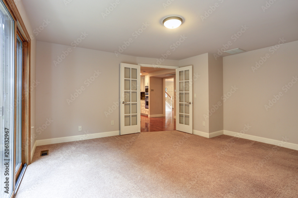 Fototapeta premium Empty room in pastel tones with exit to outdoor deck.