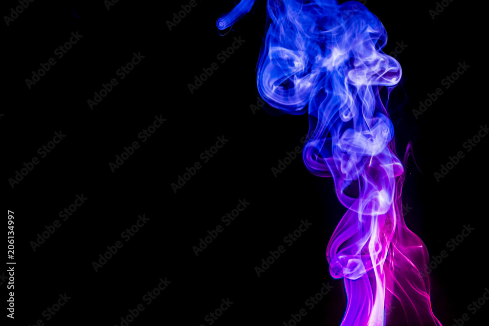 Colored smoke on black background