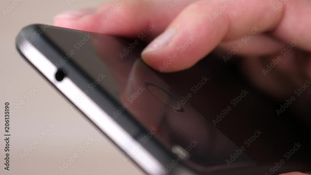 Using the back fingerprint of a smartphone. closeup