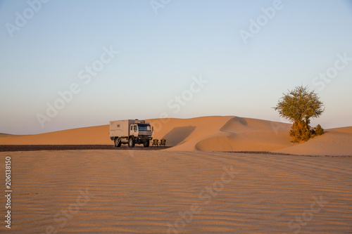 Dune camp with 4x4 expedition verhicle at a beautful sand dune in the Sahara