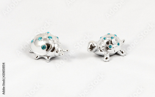 Fototapeta Naklejka Na Ścianę i Meble -  Ornamental silver turtle and ladybird with gemstones