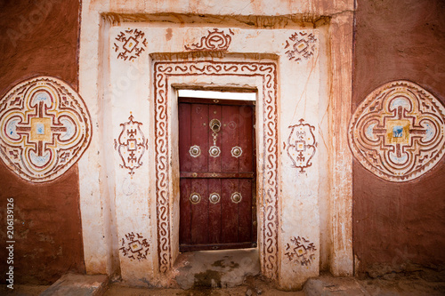 Famous ancient arabic door paintings at medieval bricked house in World Heritage Site Walata, Mauritania