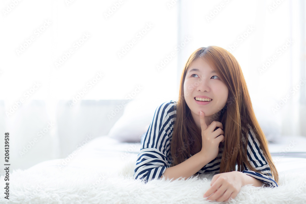 Beautiful portrait young asian woman lying and smile while wakeup with sunrise at morning, girl thinking idea something lifestyle and relax concept. Beautiful portrait young asian woman lying and smile while wakeup with sunrise at morning, girl thinking idea something lifestyle and relax concept.