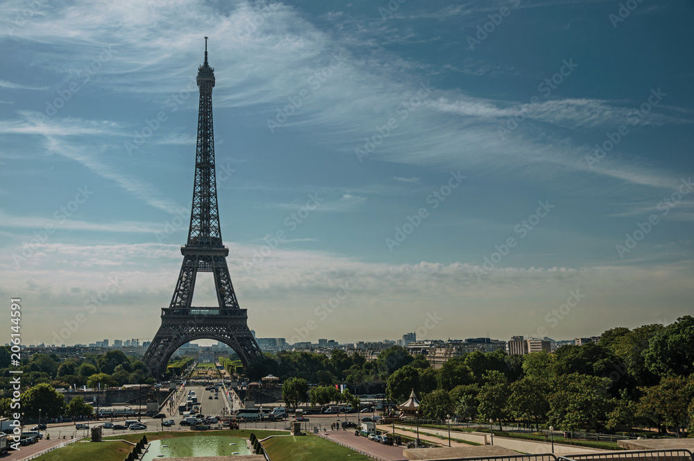 Seine River, Eiffel Tower and gardens under sunny blue sky, seen from the Trocadero in Paris. Known as the “City of Light”, is one of the most impressive world’s cultural center. Northern France.