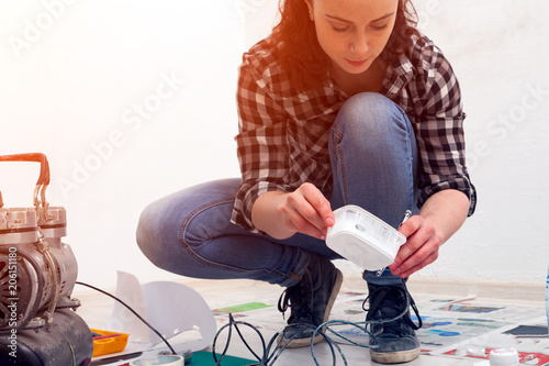 Woman paint little car photo