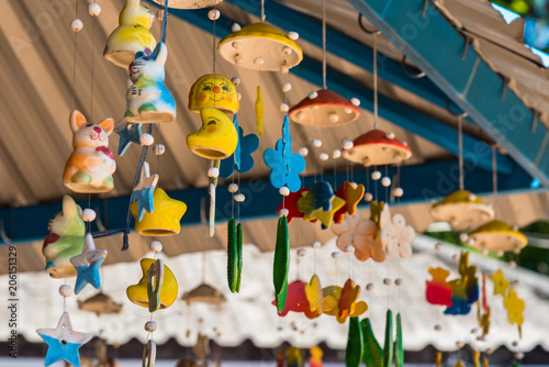 Hanging ceramic mobile, Colorful ceramic mobile hang on the thatched roof.