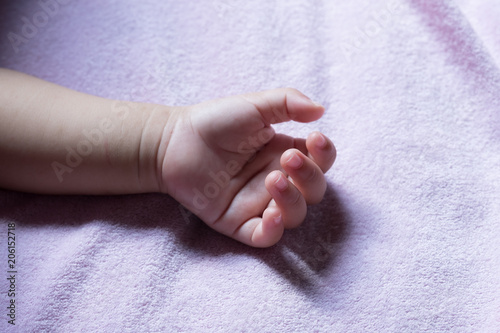 Little hand of newborn baby.