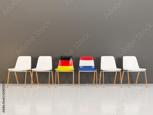 Chairs with flag of Germany and netherlands in a row