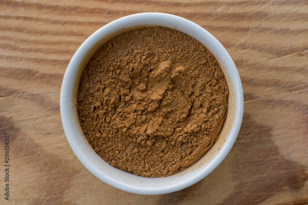 ground cinnamon in small bowl ground cinnamon in small bowl