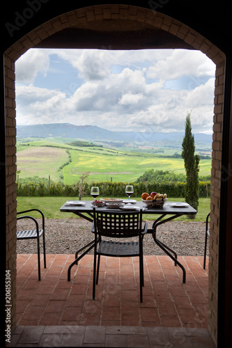 lunch with a view - table against beautiful landscape in Tuscany