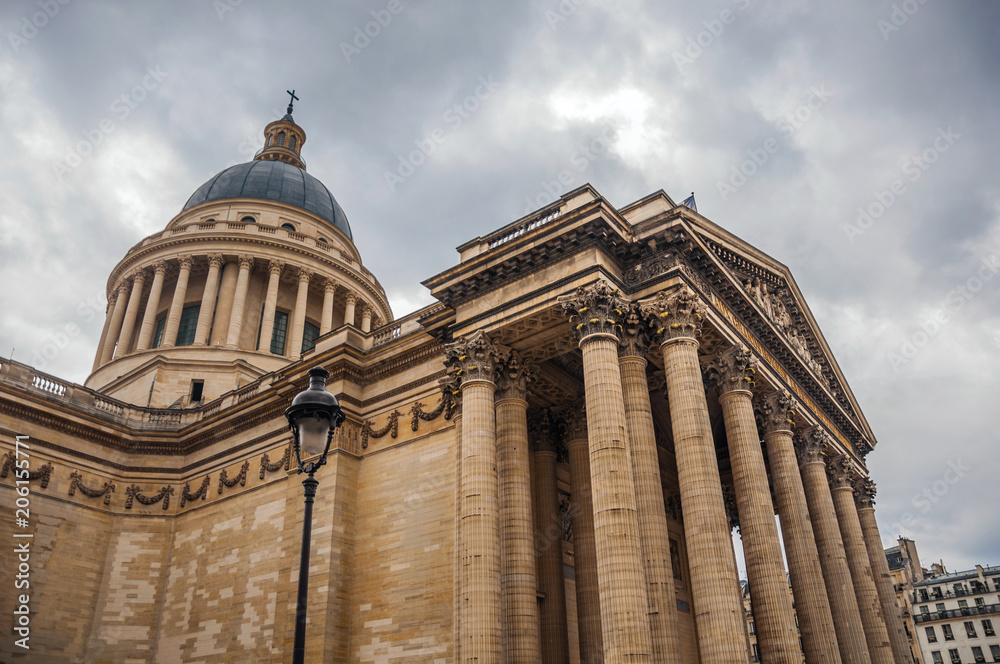 Facade of the Pantheon in Neoclassical style, with dome and columns at the entrance in Paris. Known as the “City of Light”, is one of the most impressive world’s cultural center. Northern France.
