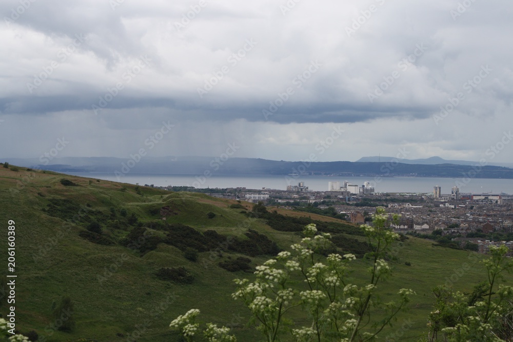 Rain in the distance, Edinburgh skyline, wildflowers and field