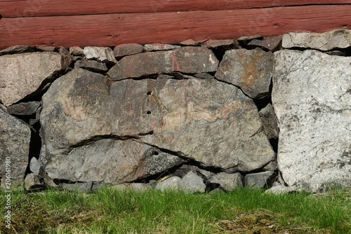 old masonry in the basement of a wooden house photo