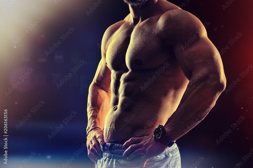 Bodybuilding fitness concept. Strong man. Fit and healthy muscular  male body with abdominal muscles