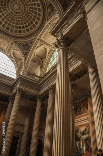 Pantheon inside view with high ceiling, columns, statues and paintings richly decorated in Paris. Known as one of the most impressive world’s cultural center. Northern France.