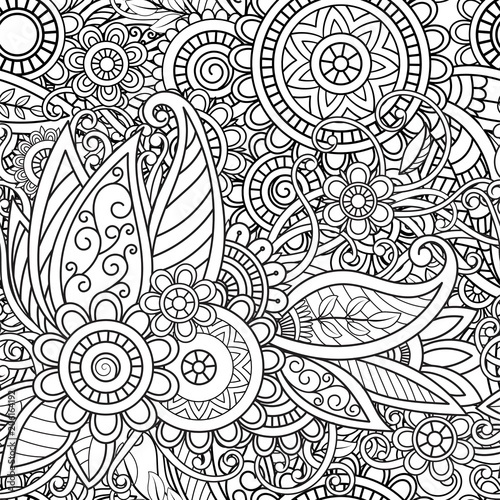 Ethnic seamless pattern with mandalas, flowers and leaves. Doodles floral black and white ornament. Perfect for wallpaper, adult coloring books, web page background, surface textures.