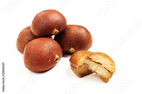 Sweet chestnuts on white background. 