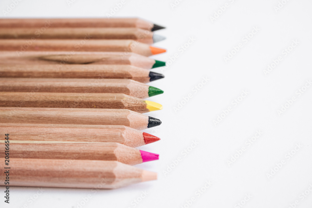 Composition of colorful pencils isolated on white background