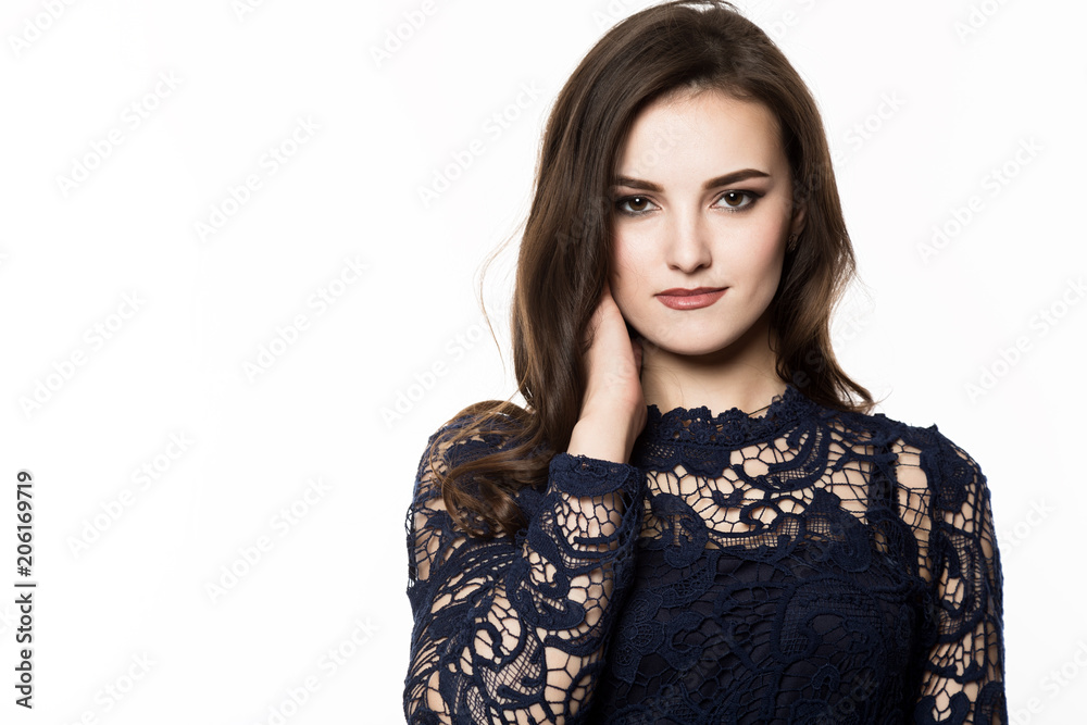 attractive young woman standing near white wall. free space for text attractive young woman standing near white wall. free space for text