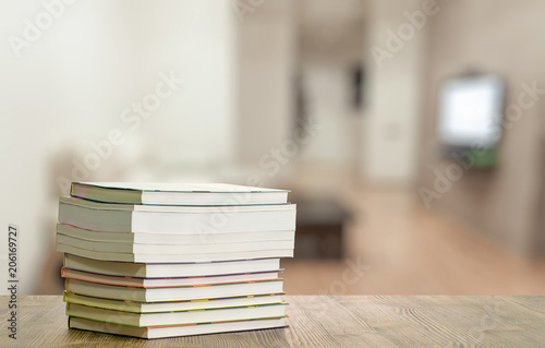 books on wooden table © vlntn